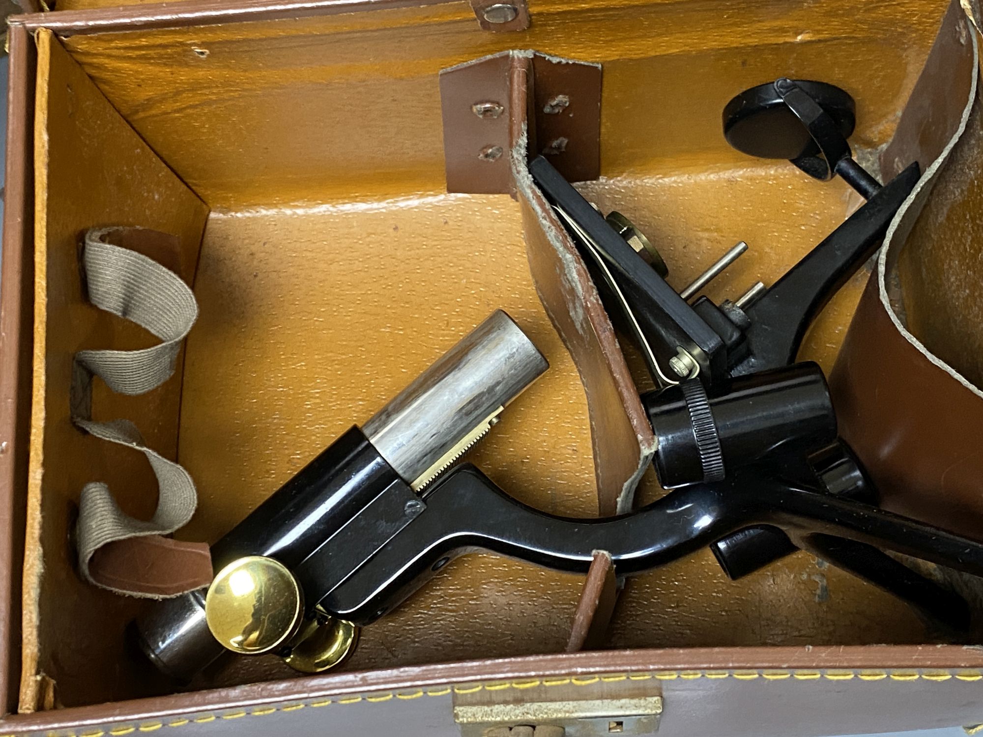 An early 20th century lacquered brass binocular microsope (unnamed) and two other microscopes by Watson & Sons, H 33cm approx